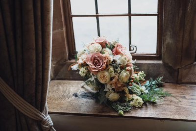 Rustic Wedding Bouquet. An elegant arrangement of soft blush and ivory tones with natural foliage, perfect for a romantic countryside wedding