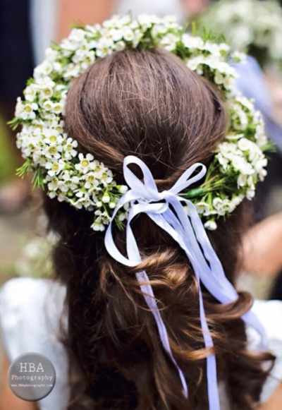 Delicate Floral Hair Crown. A charming crown of dainty white flowers, beautifully finished with flowing ribbon for a soft, romantic look
