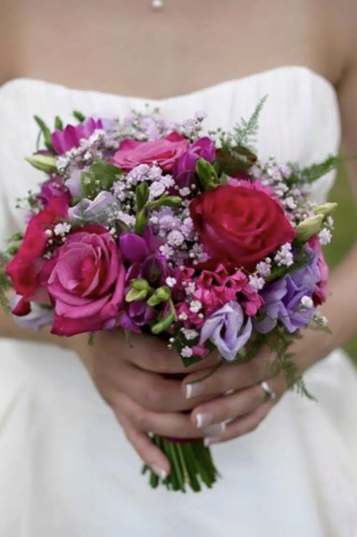 Romantic Bridal Bouquet. A gorgeous combination of rich pink, purple and lilac blooms, creating a vibrant and elegant bridal bouquet.