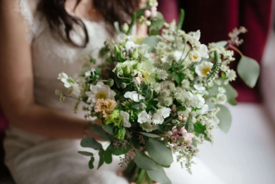 Natural Garden Bridal Bouquet. A soft and romantic mix of delicate white blooms, fresh greenery and subtle blush accents for an effortlessly elegant bridal look
