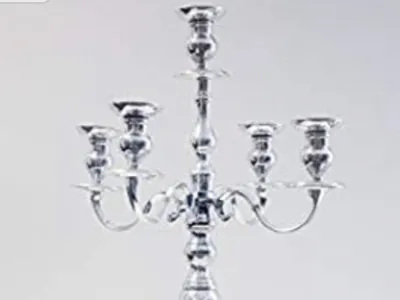 Silver Candelabra – A classic silver candelabra, perfect for adding timeless elegance and a romantic atmosphere to your wedding tables.